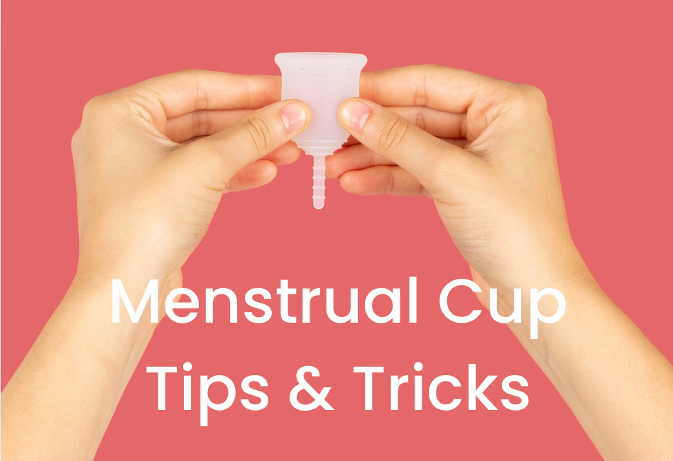 Hands holding a menstrual cup