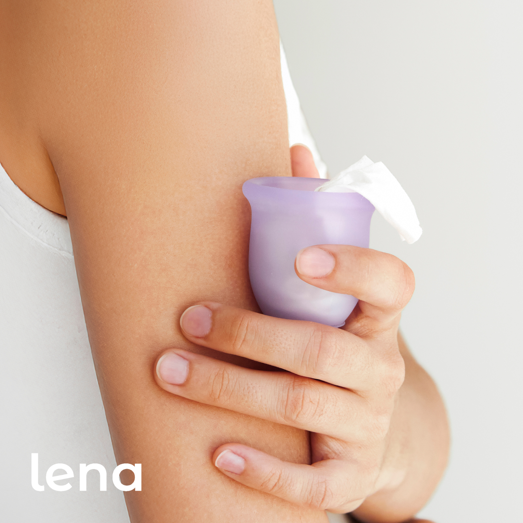 Hand using a purple device on an arm with 'lena' branding.