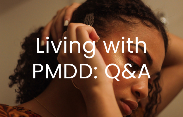 A woman looks down as she fixes her hair, the text "Living with PMDD: Q&A" is overlaid