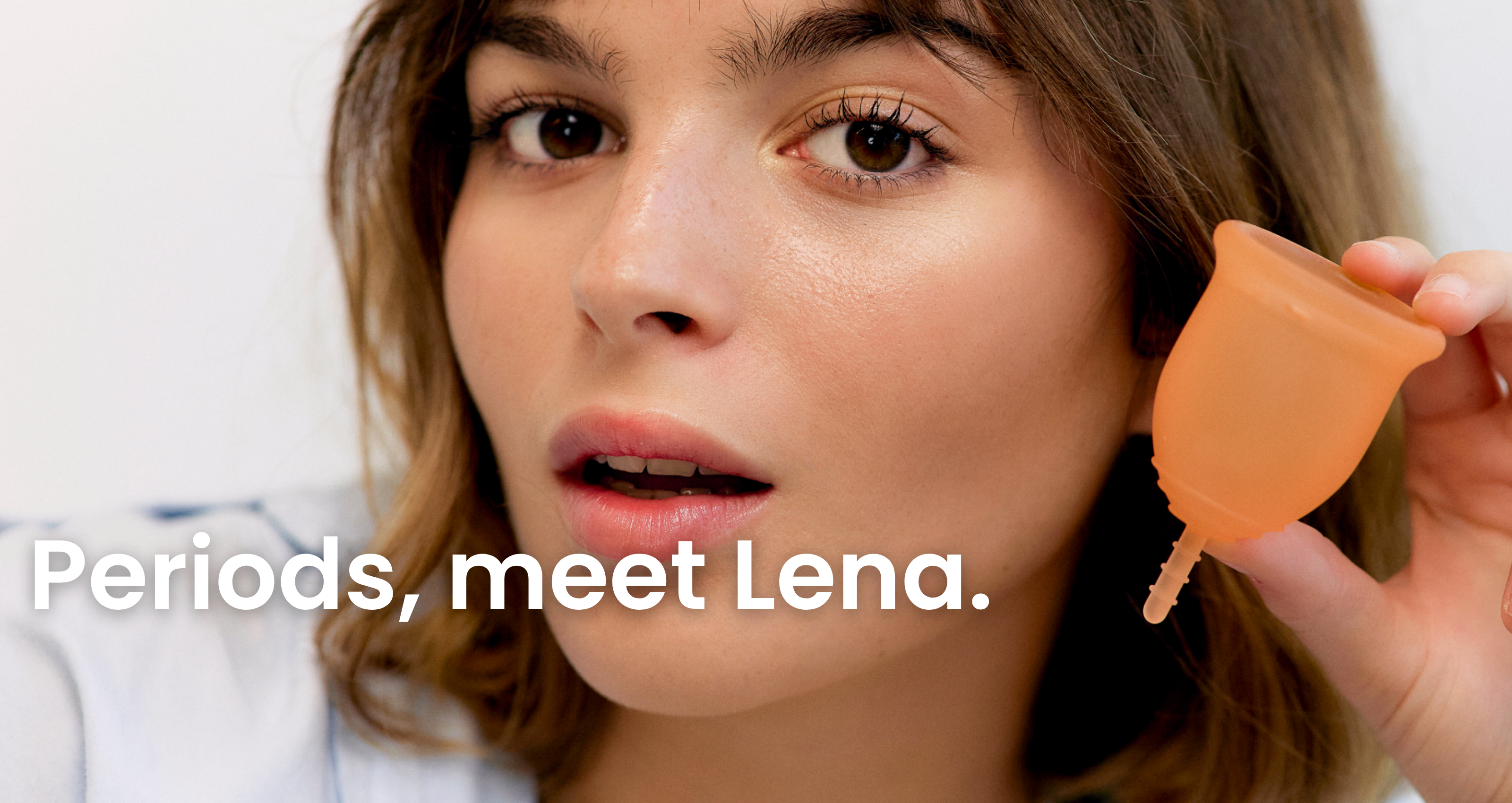 Woman holding an orange menstrual cup with text 'Periods, meet Lena' on a white background