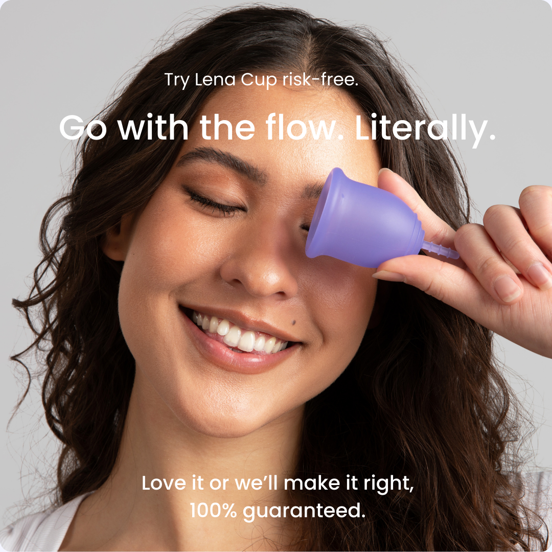 Woman holding a purple menstrual cup near her eye with promotional text on a gray background