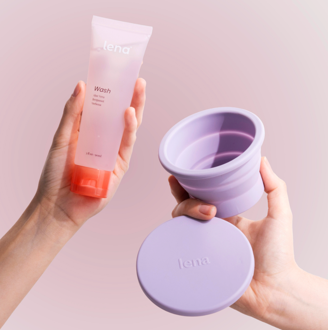 Hand holding Lena Wash tube and hand holding Lena leaning Container in Purple