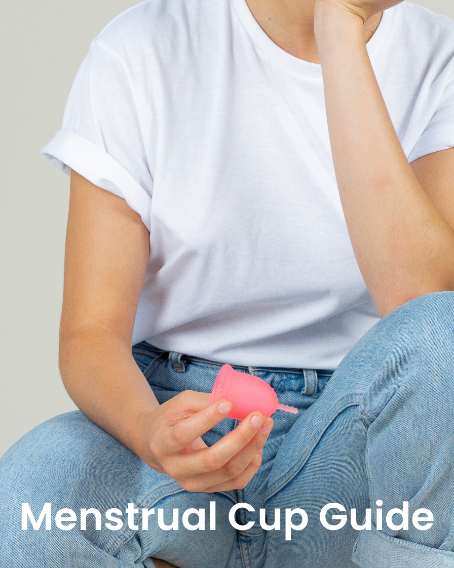Person holding a menstrual cup with text 'Menstrual Cup Guide' on a plain background