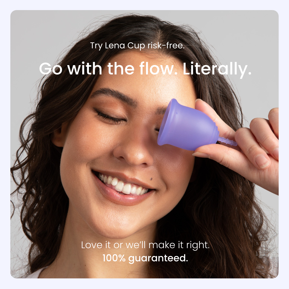 Woman holding a purple menstrual cup near her face with promotional text about the Lena Cup.