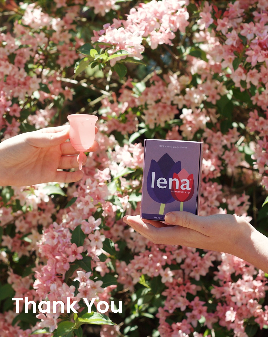 Hand holding a Lena Menstrual Cup, another hand holding a Lena Cup Box
