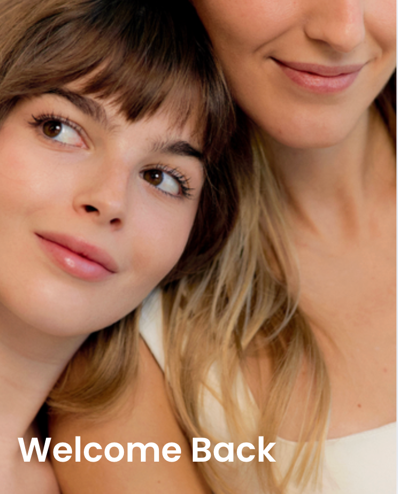 Two women close together with 'Welcome Back' text overlay